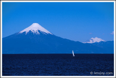Sailboat and Volcán Osorno -- Photo © Chris Carvalho/Lensjoy.com